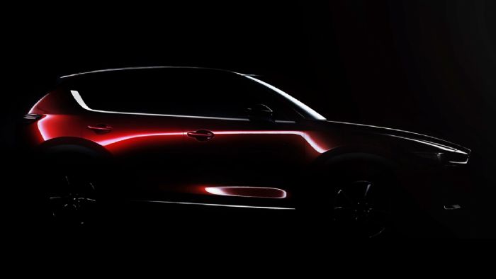 Στη σκοτεινή προωθητική εικόνα του νέου Mazda CX-5, βλέπουμε κάτι σαν το μικρό αδελφό του CX-9, με χαμηλωμένο προφίλ και πιο «σφιχτές» γραμμές.