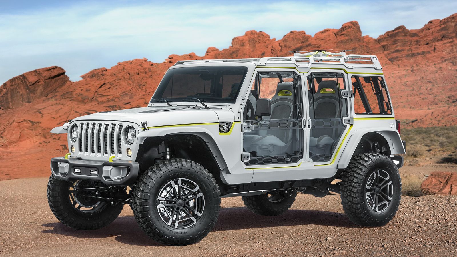 Το Jeep Safari βασίζεται στο Wrangler και ξεχωρίζει με τα διάφανα πάνελ, ενώ εντύπωση προκαλούν τα αλουμινένια στοιχεία στις πόρτες και η κατασκευή στ