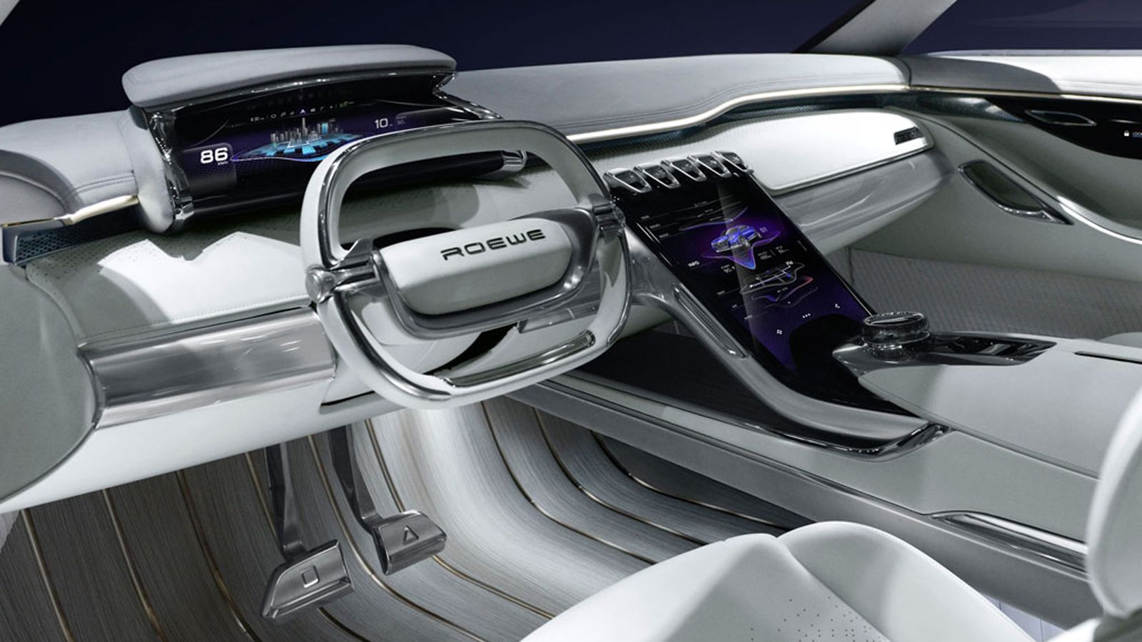 Στο εσωτερικό του Roewe Vision-E παρατηρείς το τετραγωνισμένο τιμόνι, τον ψηφιακό πίνακα οργάνων και το heads-up display. Το μεγαλύτερο μέρος της κεντ