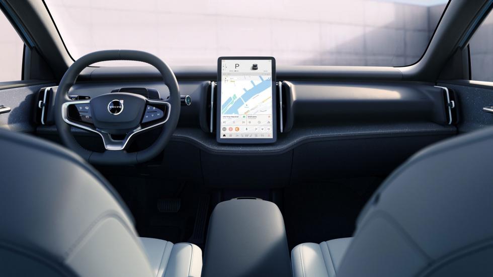 Στη μίνιμαλ καμπίνα του Volvo EX30 λάμπουν δια της απουσίας τους τα φυσικά πλήκτρα, με τα ανοιχτόχρωμα σκληρής υφής πλαστικά να προέρχονται από ανακυκλώσιμα υλικά.